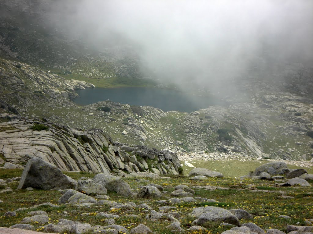 Small lake and fog over the Pirin Mountains